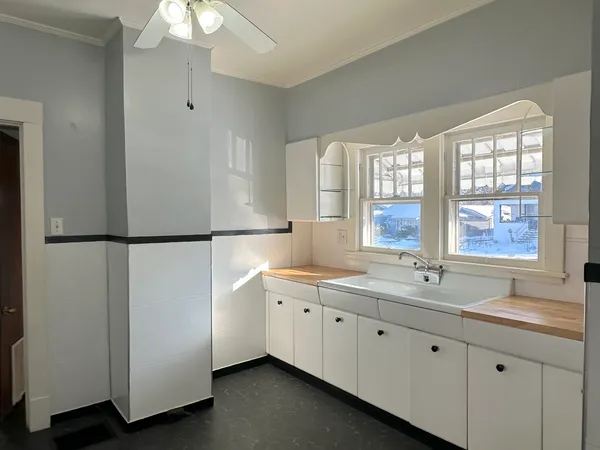 a spacious bathroom with a double vanity sink and a window