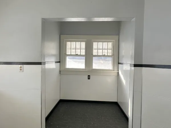 a view of an empty room with a window
