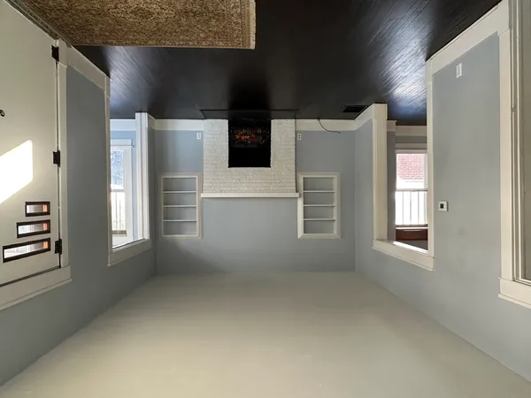an empty room with windows