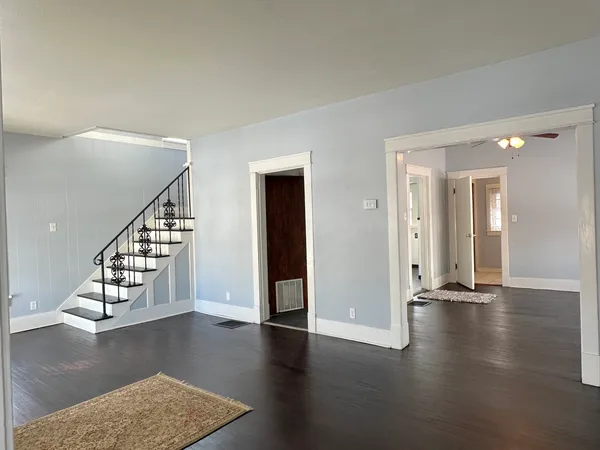 a view of an entryway with wooden floor