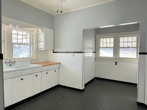 a spacious bathroom with a double vanity sink and mirror
