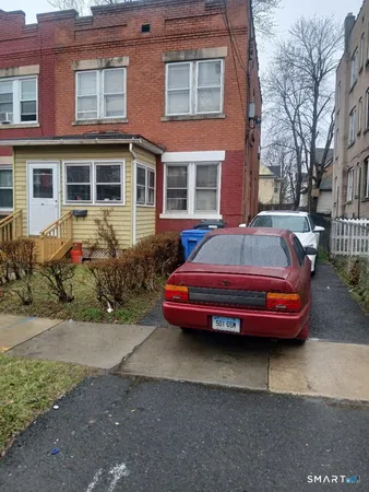 a view of a yard in front of a brick house