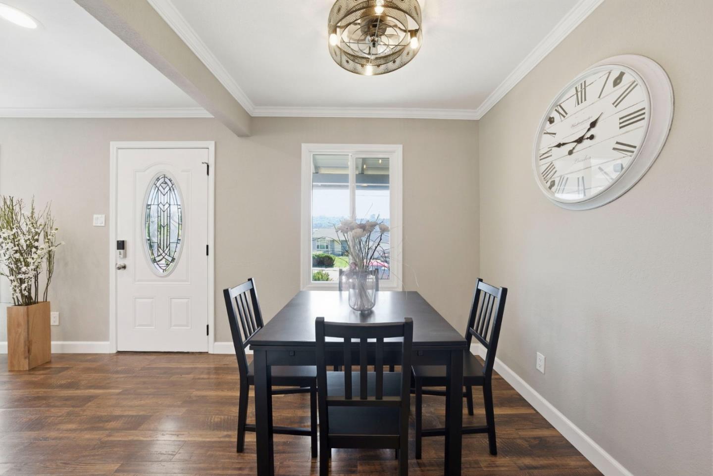 2793 Ruff Court Pinole, CA 94564 - Photo 13 of 53 a view of a dining room with furniture a rug and wooden floor