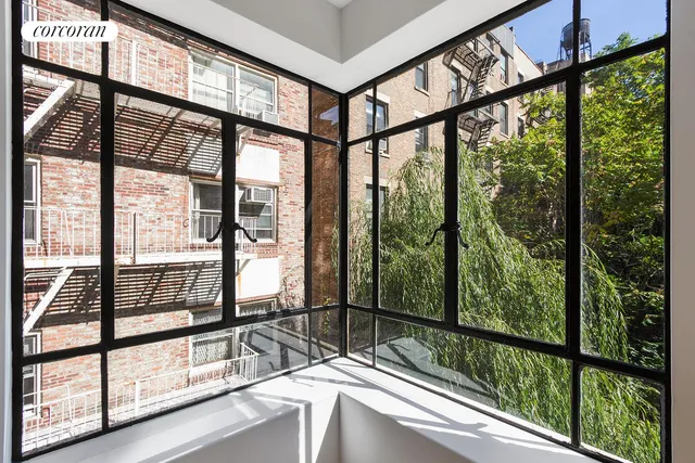 a view of a glass door with a balcony