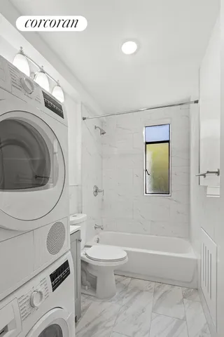 a bathroom with a toilet a sink and a bathtub