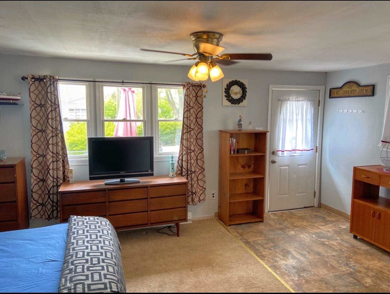 210 South Railroad Avenue Rio Grande, NJ 08242 - Photo 13 of 36 a living room with furniture and a flat screen tv