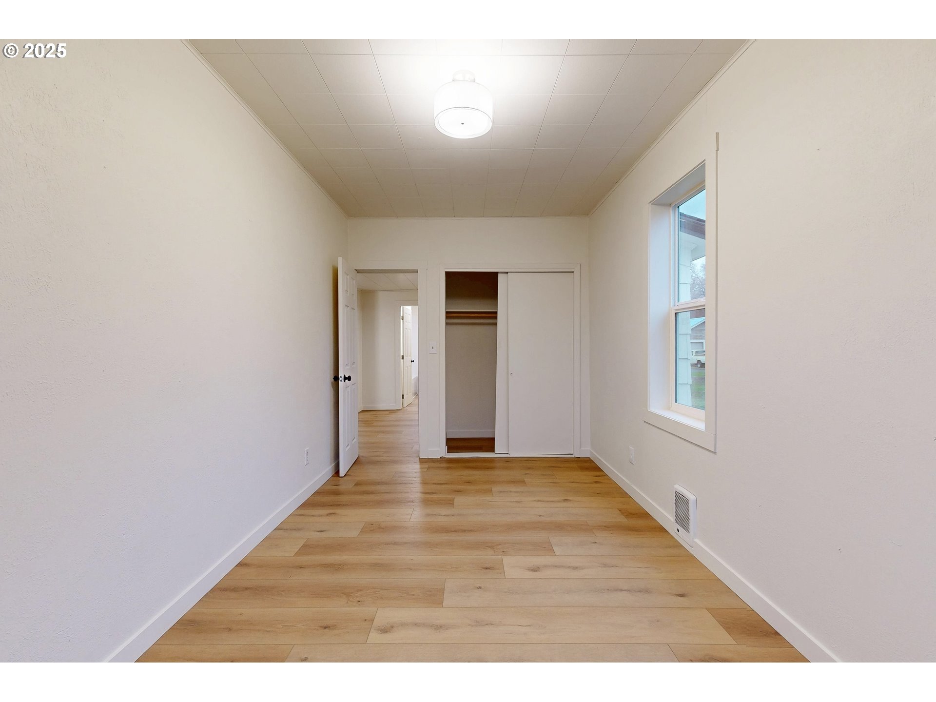 1209 Chestnut Street Milton Freewater, OR 97862 - Photo 11 of 23 a view of an empty room with wooden floor