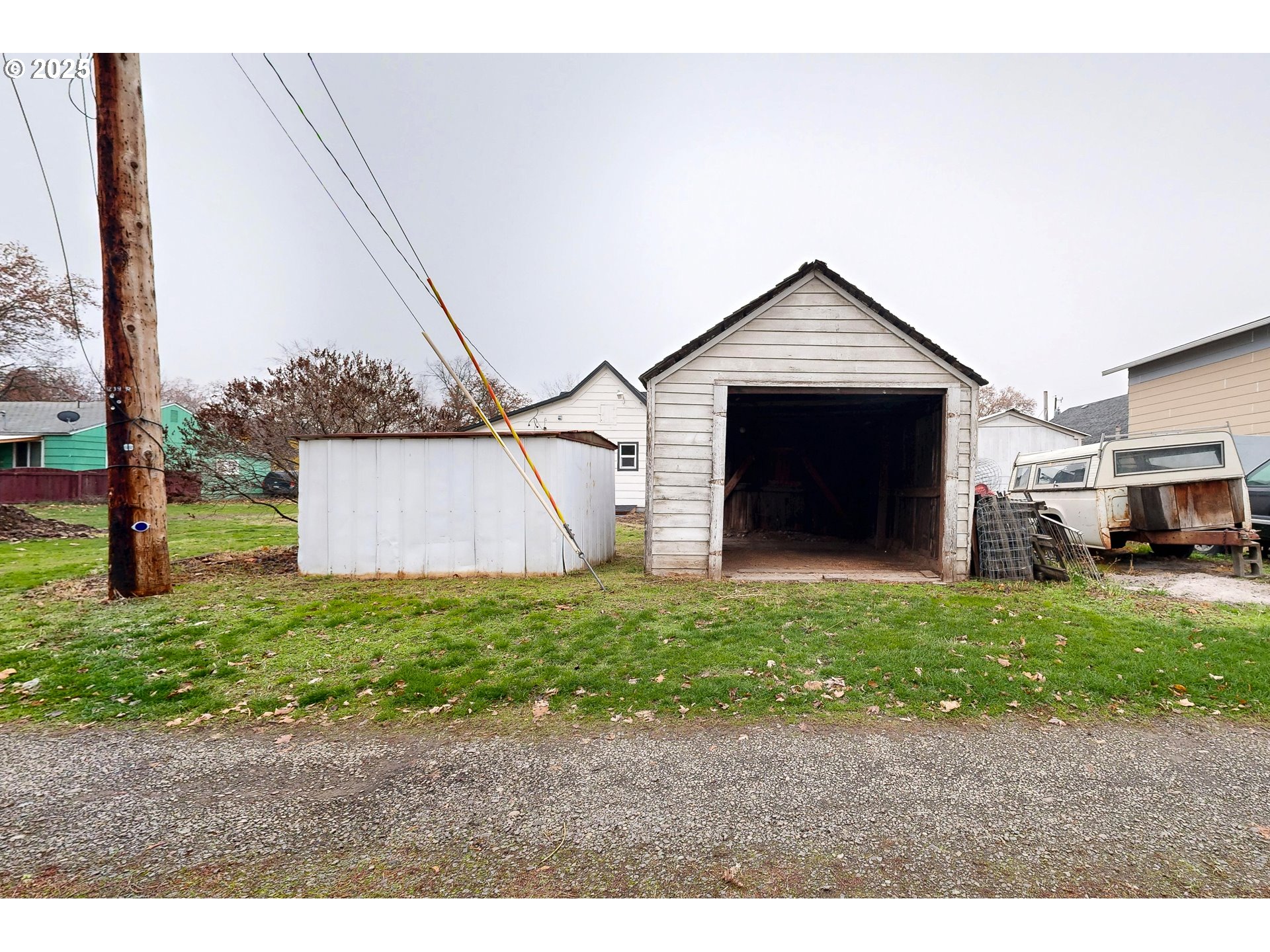 1209 Chestnut Street Milton Freewater, OR 97862 - Photo 21 of 23 a front view of a house with a yard and garage