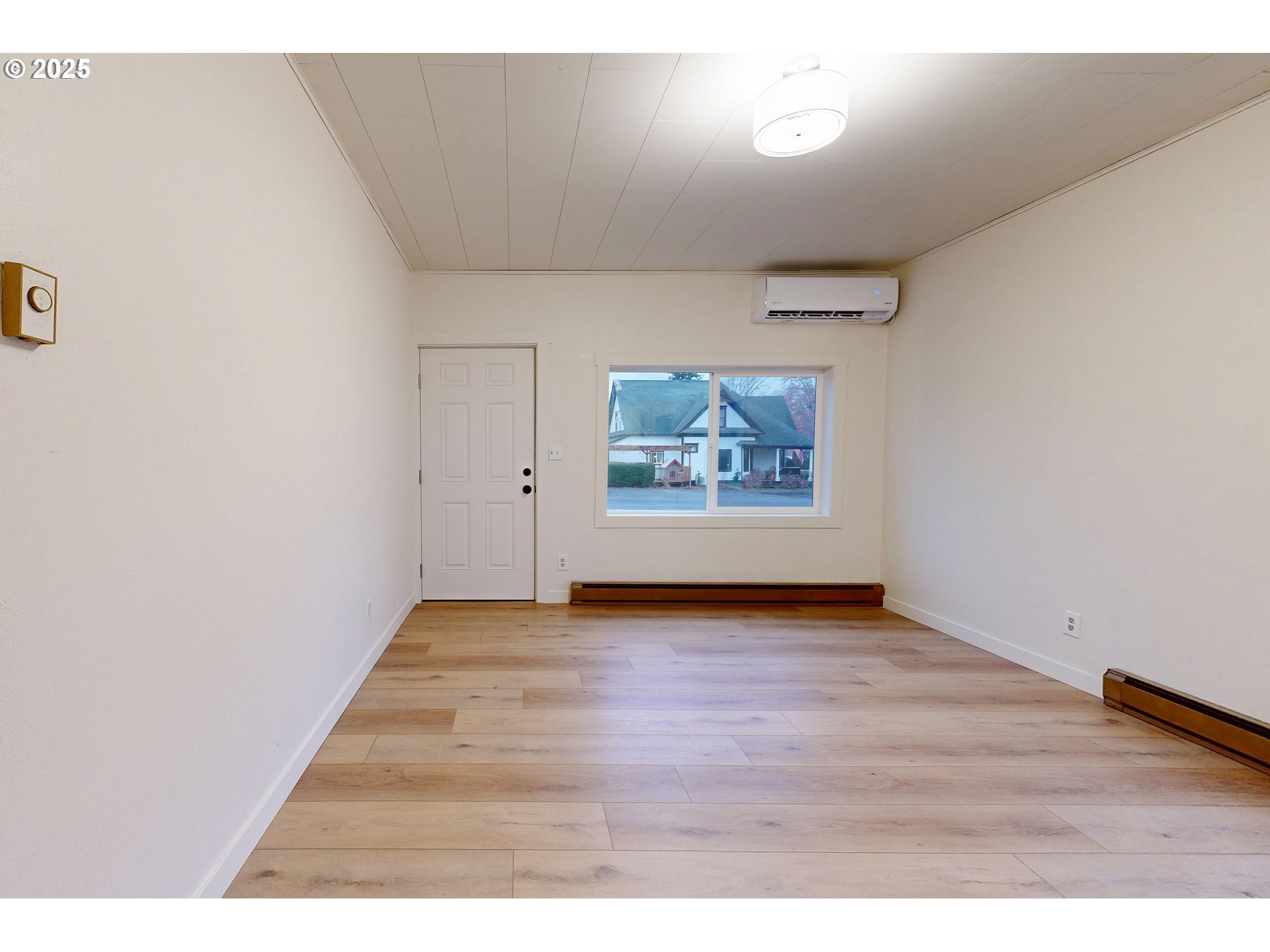 1209 Chestnut Street Milton Freewater, OR 97862 - Photo 3 of 23 a view of an empty room with wooden floor