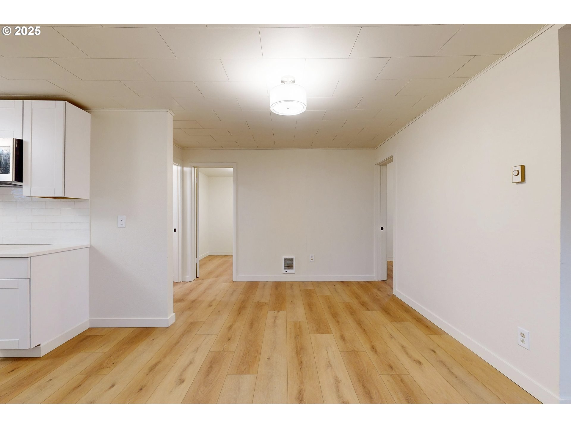 1209 Chestnut Street Milton Freewater, OR 97862 - Photo 5 of 23 a view of an empty room with window and wooden floor