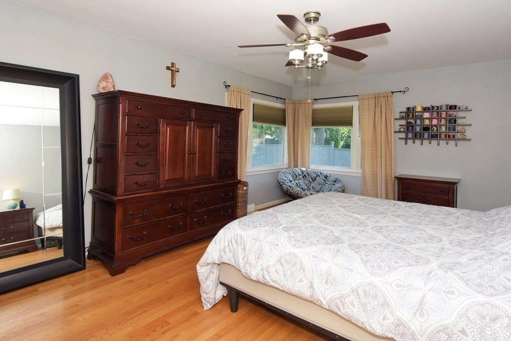 64 Kinnicutt Road Worcester, MA 01602 - Photo 14 of 38 a bedroom with a bed and a chandelier