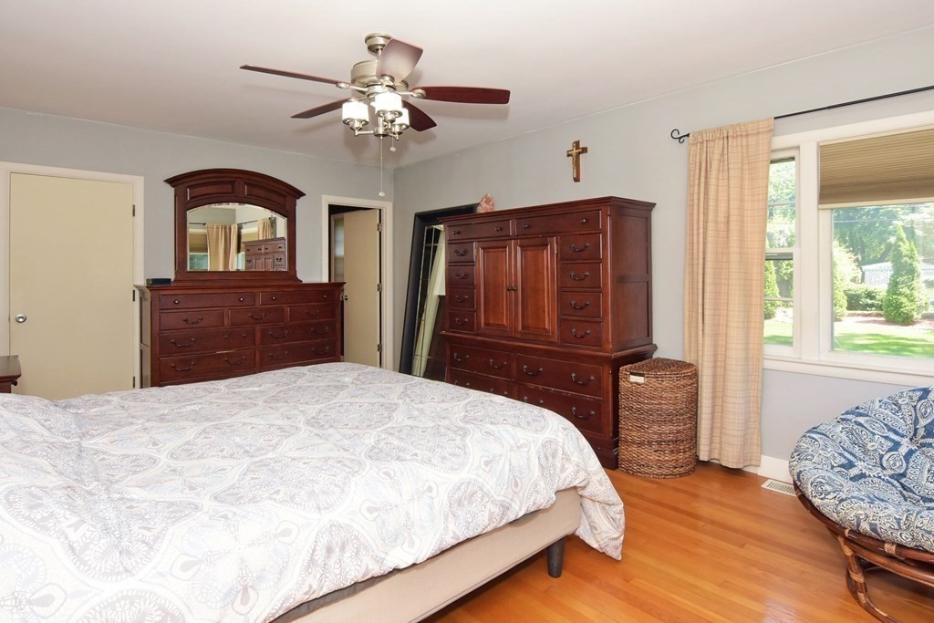 64 Kinnicutt Road Worcester, MA 01602 - Photo 15 of 38 a bedroom with a bed and dresser with mirror