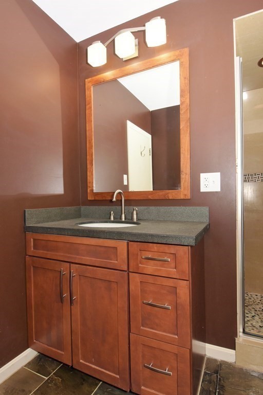 64 Kinnicutt Road Worcester, MA 01602 - Photo 17 of 38 a bathroom with a sink and a mirror