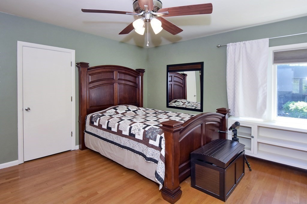 64 Kinnicutt Road Worcester, MA 01602 - Photo 19 of 38 a bedroom with a large bed and a chandelier