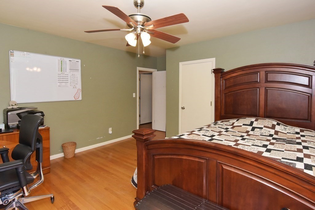 64 Kinnicutt Road Worcester, MA 01602 - Photo 20 of 38 a bedroom with a bed and a chandelier