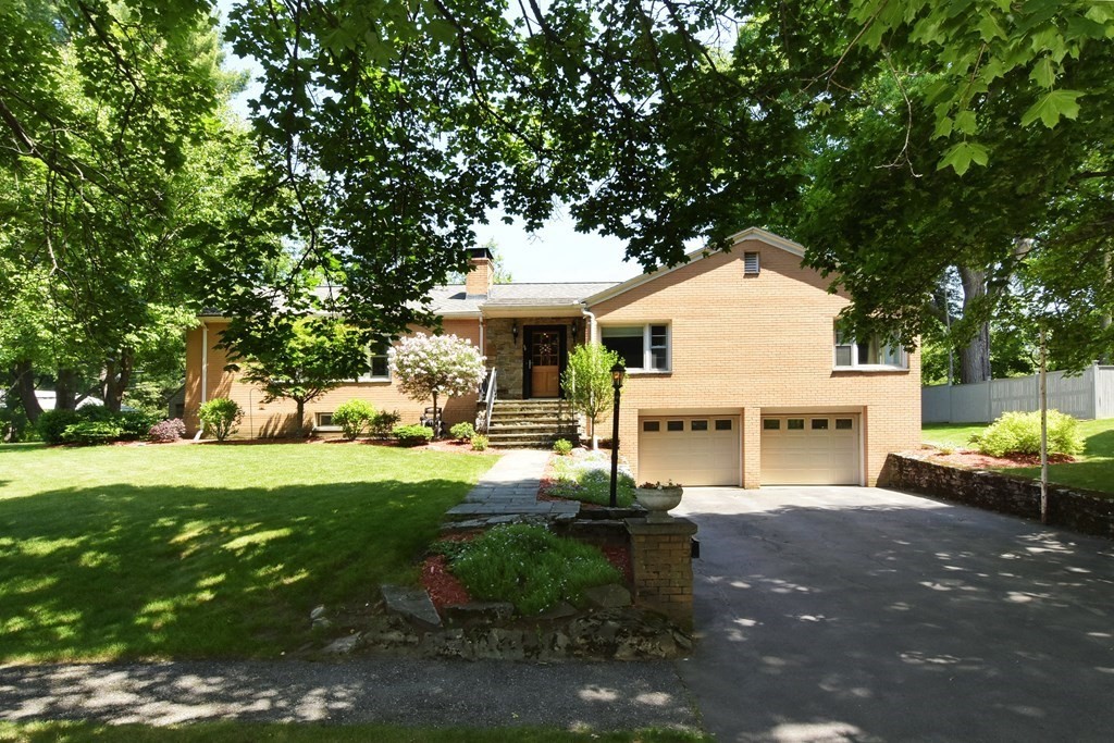64 Kinnicutt Road Worcester, MA 01602 - Photo 2 of 38 a front view of a house with garden