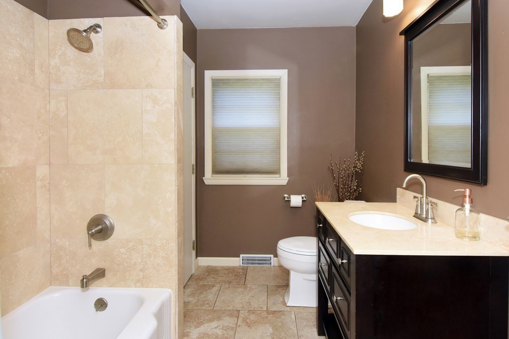 64 Kinnicutt Road Worcester, MA 01602 - Photo 23 of 38 a bathroom with a sink and a mirror