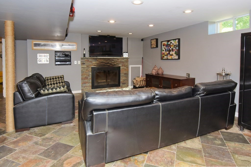 64 Kinnicutt Road Worcester, MA 01602 - Photo 30 of 38 a living room with furniture and a fireplace