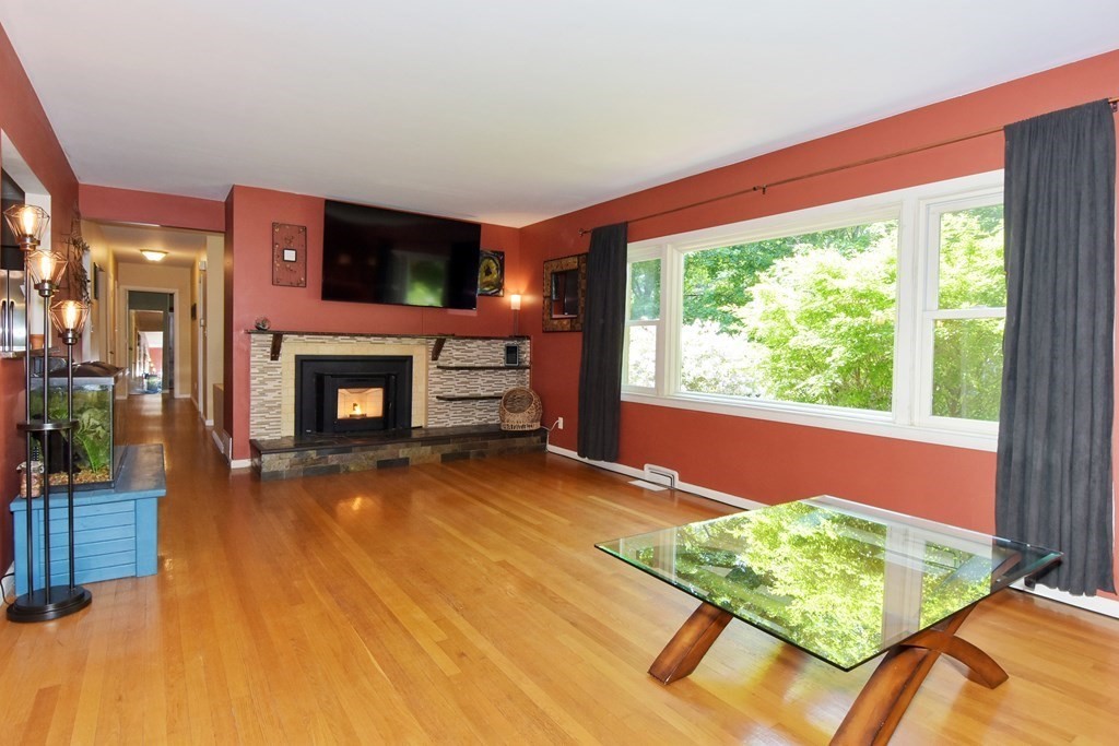 64 Kinnicutt Road Worcester, MA 01602 - Photo 3 of 38 a living room with fireplace furniture and a fireplace