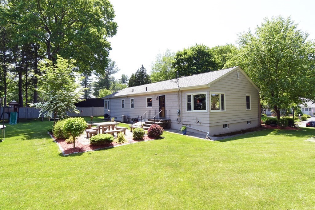 64 Kinnicutt Road Worcester, MA 01602 - Photo 33 of 38 a front view of house with yard and trees in the background