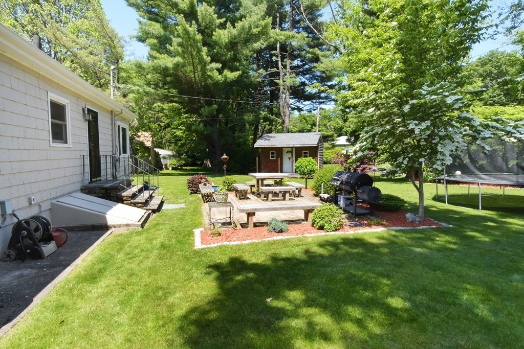 64 Kinnicutt Road Worcester, MA 01602 - Photo 34 of 38 a view of a backyard with table and chairs and a slide