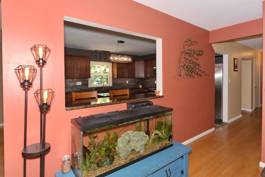 64 Kinnicutt Road Worcester, MA 01602 - Photo 6 of 38 a living room with furniture a flat screen tv and a table