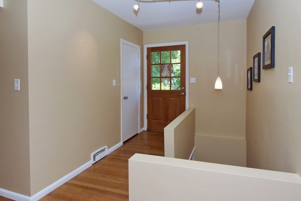 64 Kinnicutt Road Worcester, MA 01602 - Photo 7 of 38 a view of a hallway with wooden floor and entryway