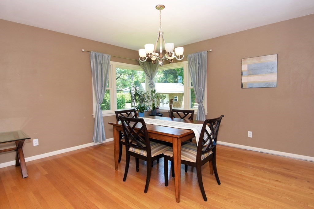 64 Kinnicutt Road Worcester, MA 01602 - Photo 8 of 38 a view of a dining room with furniture a chandelier and wooden floor