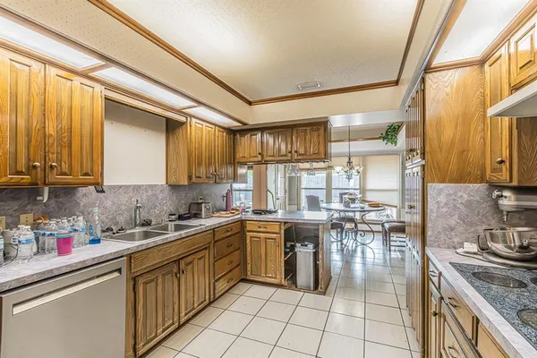 a kitchen with a sink stove and cabinets