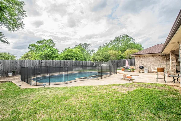 a view of a backyard with a slide and a slide