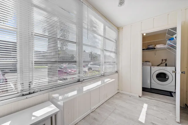 a bathroom with a bathtub and a window