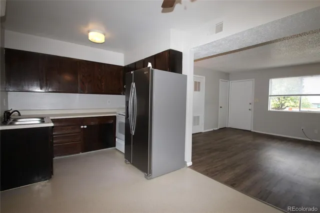 an empty room with a empty space and a ceiling fan