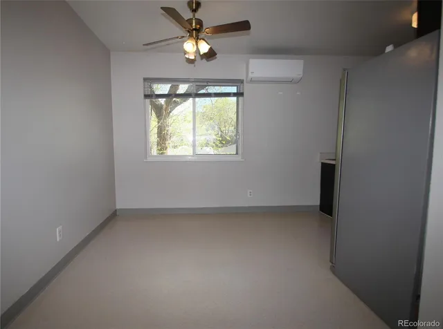 an empty room with wooden floor