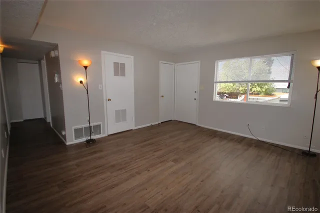 a kitchen with a refrigerator and a sink