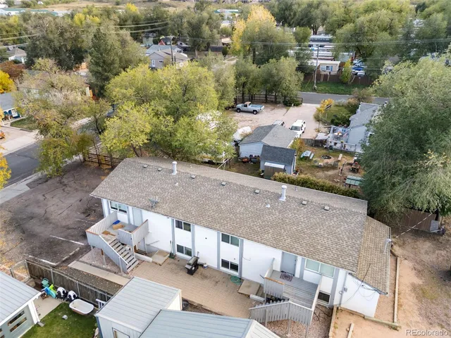 an aerial view of a house with a yard