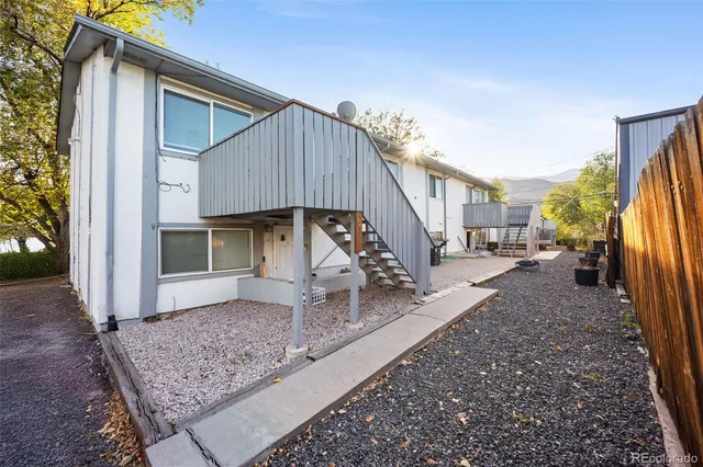 an aerial view of residential houses with outdoor space
