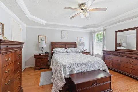 a bedroom with a bed and a dresser