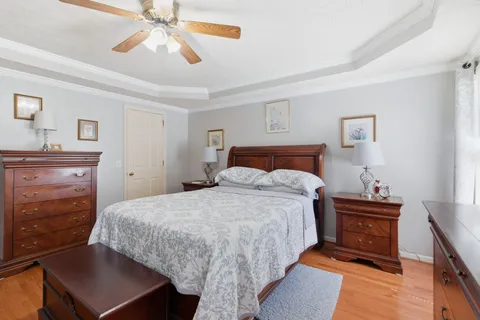 a bedroom with a bed and a dresser