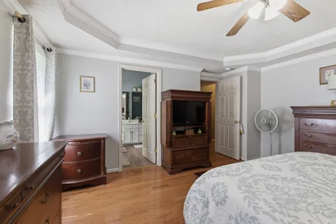 a bedroom with a bed and a dresser