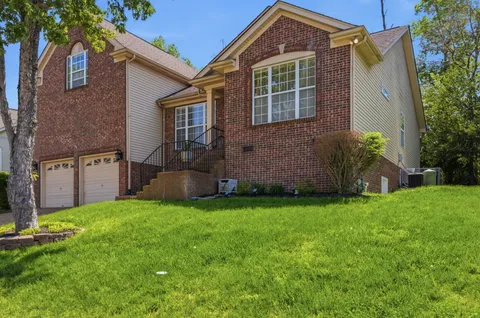front view of a house with a yard