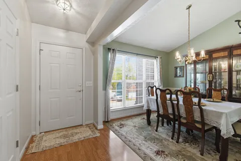 a view of a a dining room with furniture window and outside view