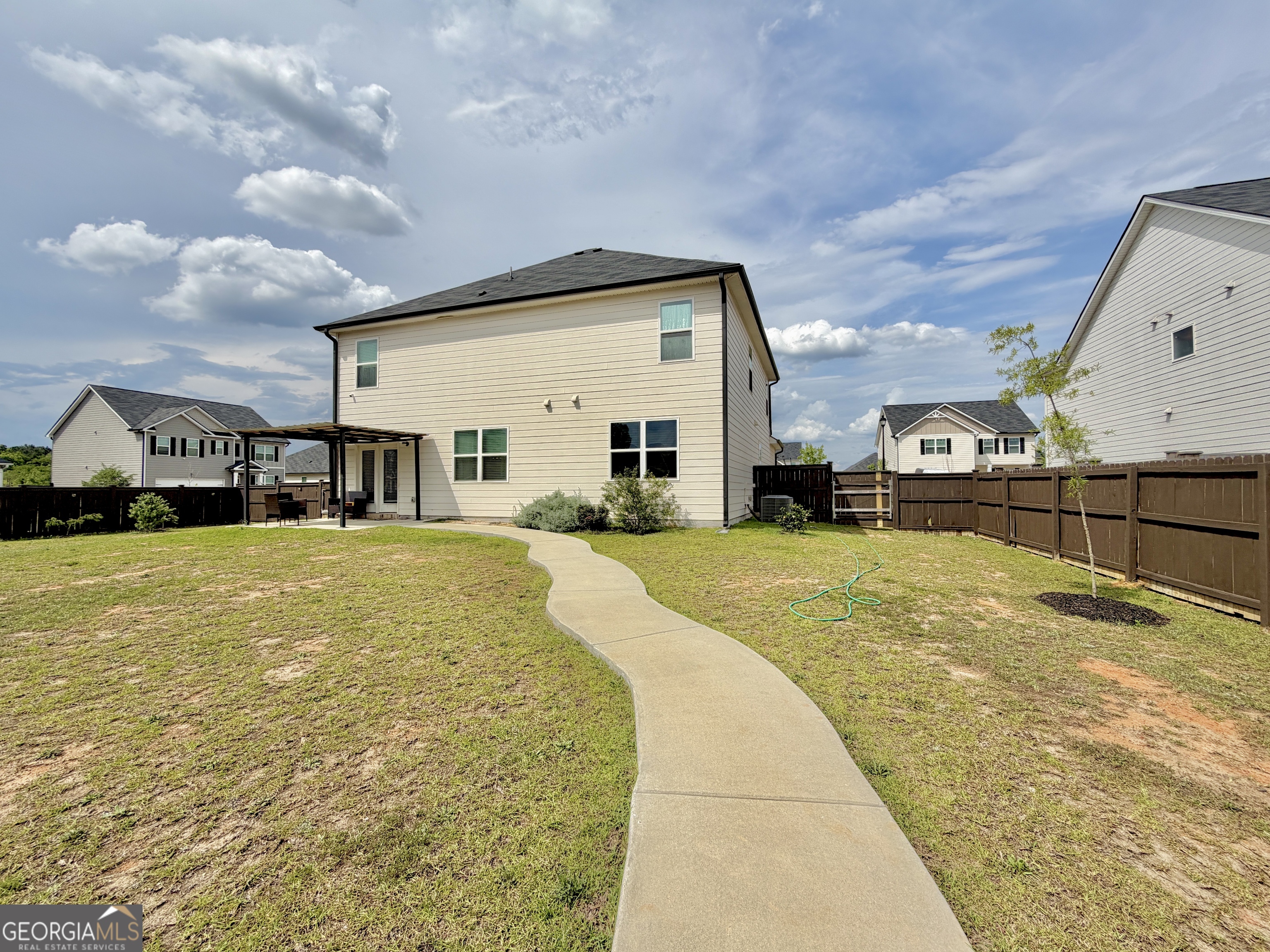 219 Barnyard Way Perry, GA 31069 - Photo 40 of 44 a swimming pool view with a outdoor seating