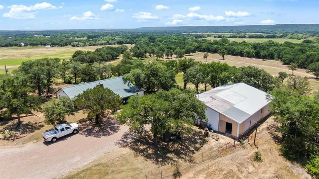 an aerial view of a house with garden space and outdoor space