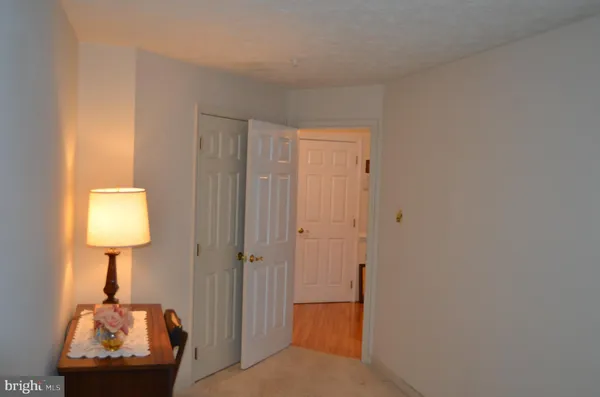 a room that has a bed and a table in it