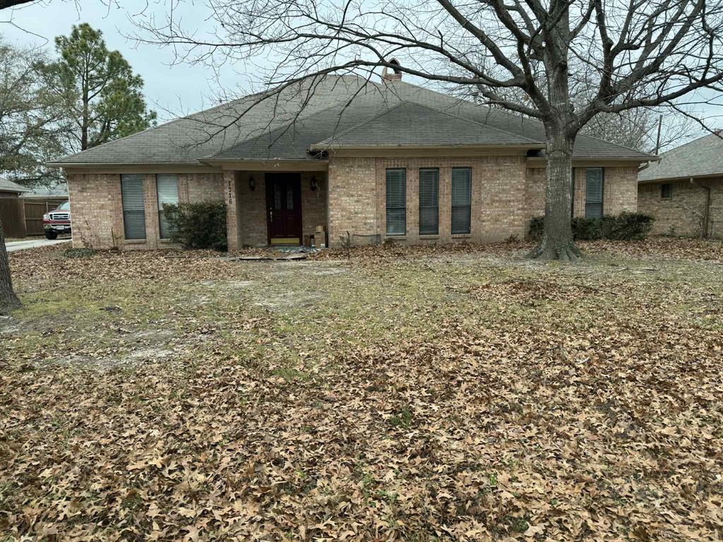 1316 Edna Street Commerce, TX 75428 - Photo 1 of 16 a view of a yard in front of a house