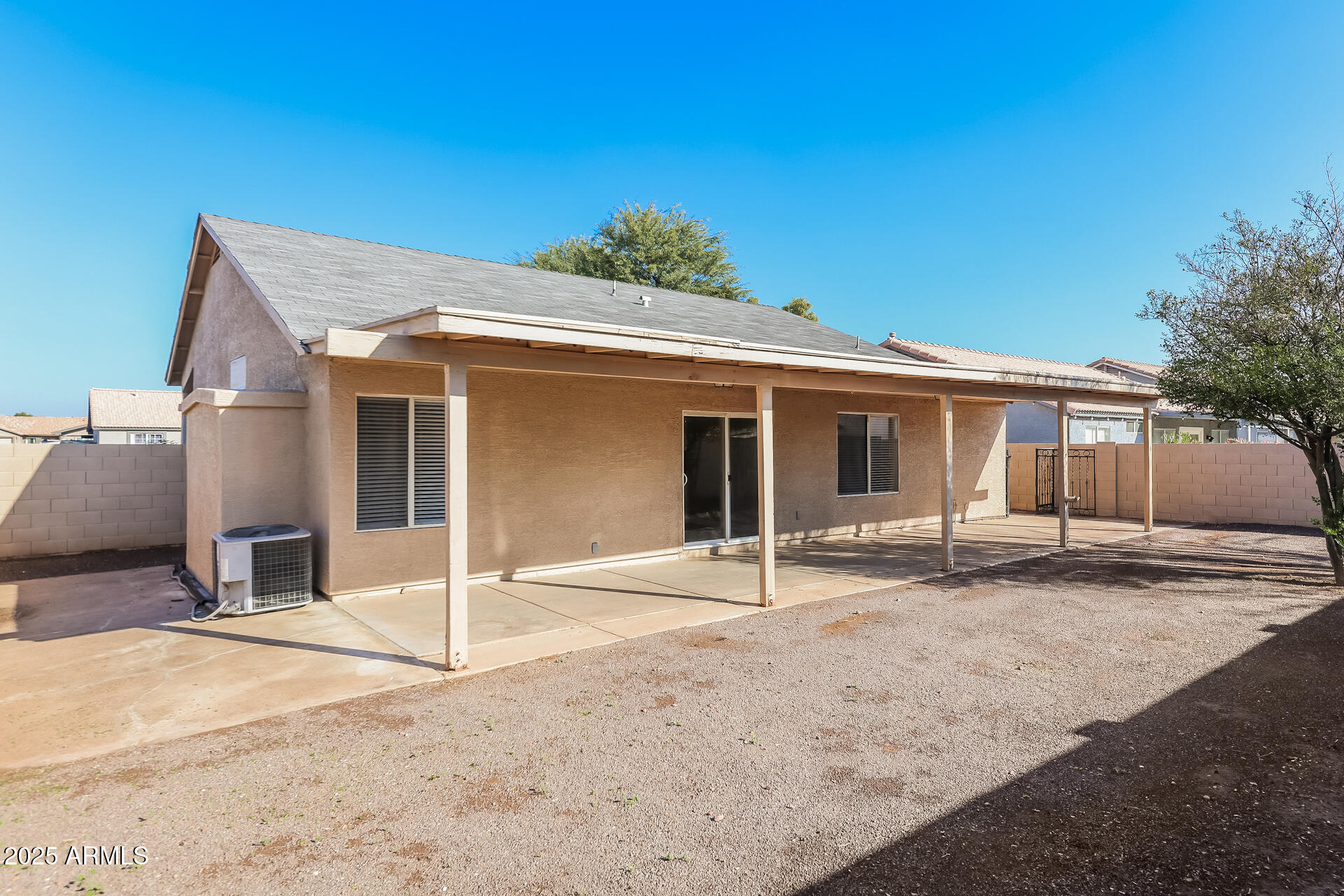 8833 West Monte Vista Road Phoenix, AZ 85037 - Photo 19 of 21 a house with trees in the background