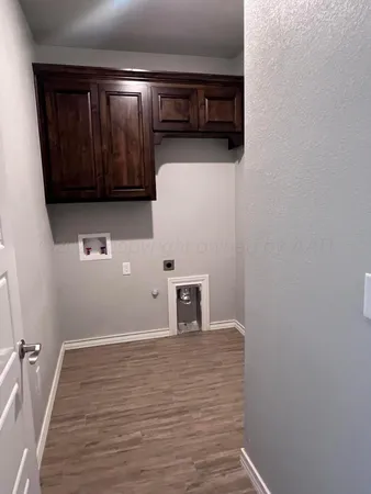 an empty room with a ceiling fan and windows