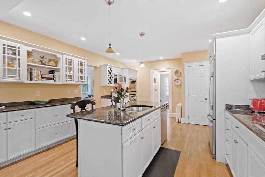 30 Burlington Street Lexington, MA 02420 - Photo 15 of 34 a kitchen with stainless steel appliances granite countertop a sink and cabinets