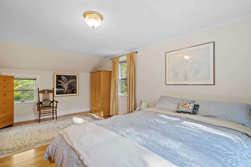 30 Burlington Street Lexington, MA 02420 - Photo 20 of 34 a bedroom with a bed and wooden floor
