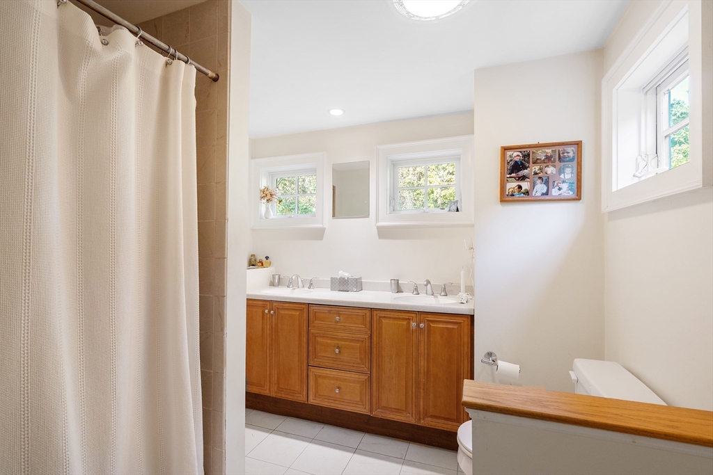 30 Burlington Street Lexington, MA 02420 - Photo 22 of 34 a view of cabinets with window and bathroom